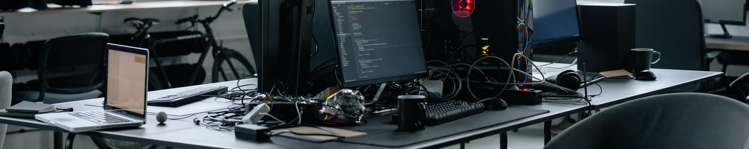 A developer workspace with code on screen, representing BrightXR's hands-on industrial training tracks